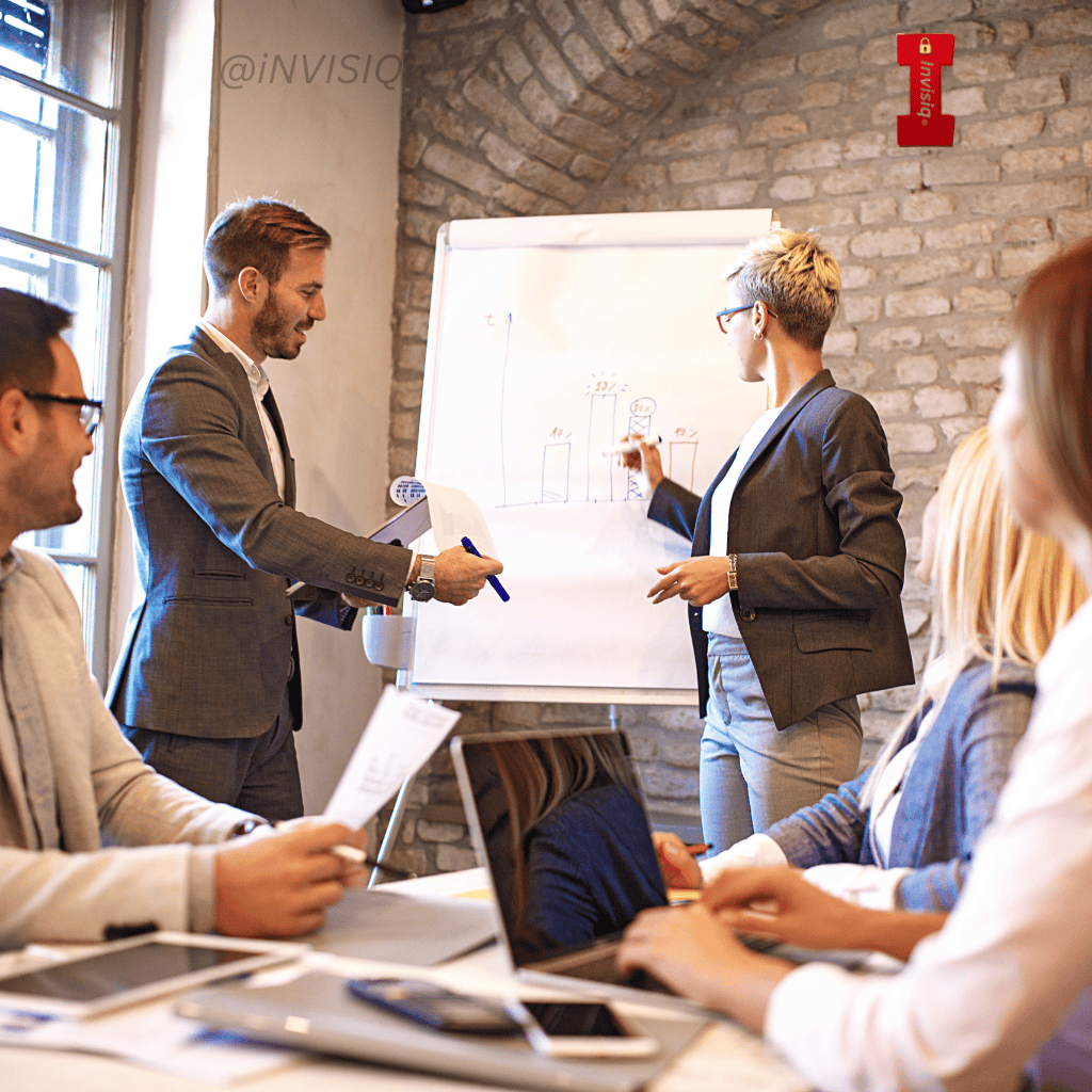 Business leaders reviewing marketing performance charts during a strategy meeting, highlighting how growth decisions can introduce cybersecurity risk in 2026